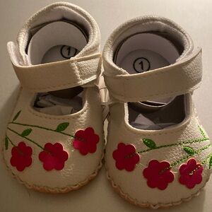 White Leather with flowers baby shoes.